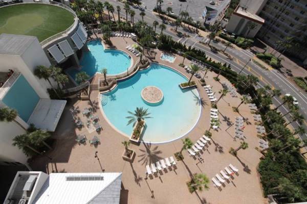 Circle-shaped pool surrounded by chairs at Laketown Wharf Resort.