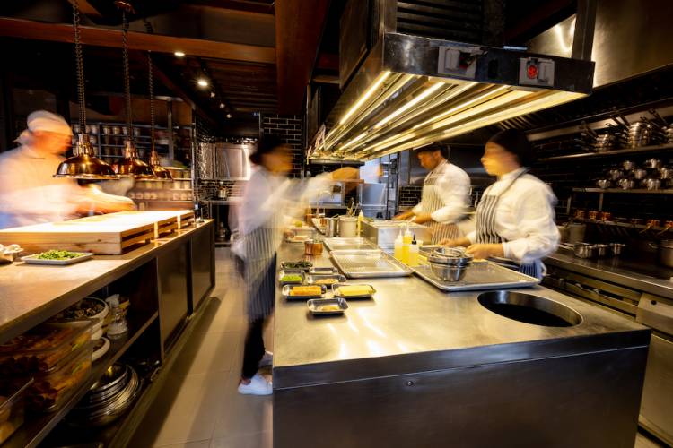 busy restaurant kitchen with blurry elements