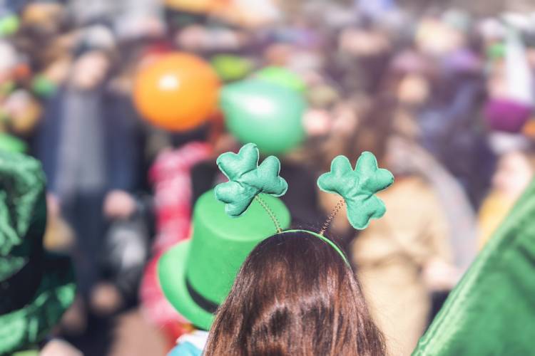 girl wearing clover hat at St. Patrick's parade
