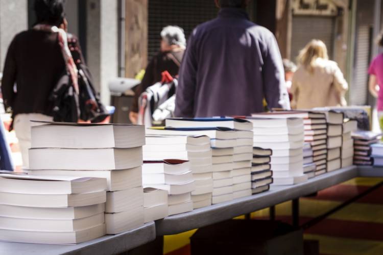 table of books at an outdoor literary festival