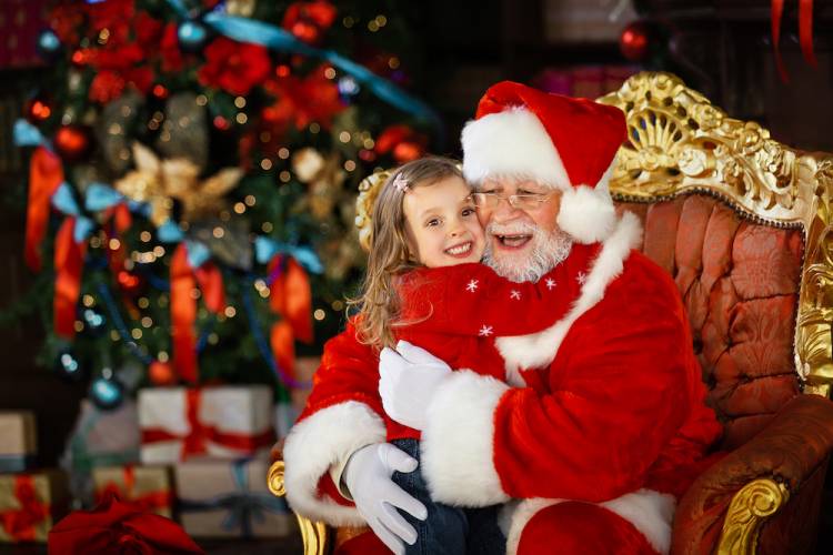 little girl hugging santa