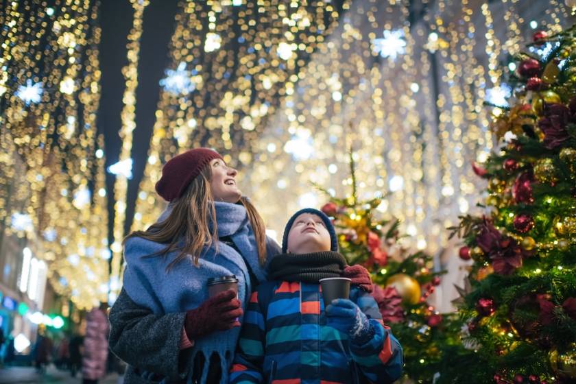 mother and son looking at Christmas lights 