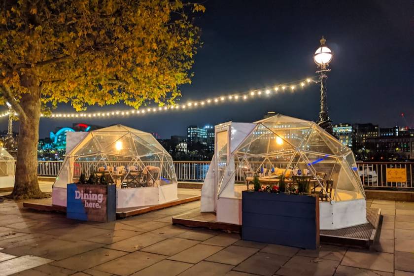 people dining in an insulated igloo